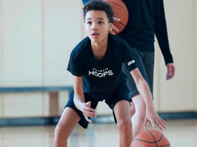young boy in basketball training